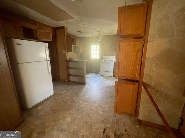 kitchen featuring white appliances and ceiling fan