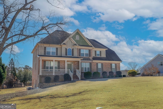 view of front of house with a front lawn and a porch