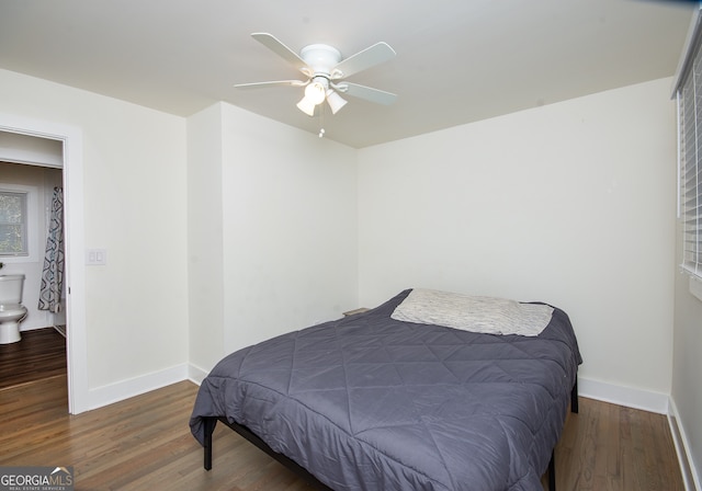 bedroom with ceiling fan and dark hardwood / wood-style flooring