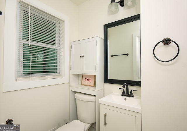 bathroom featuring vanity and toilet