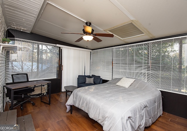 bedroom featuring ceiling fan, wood-type flooring, and vaulted ceiling