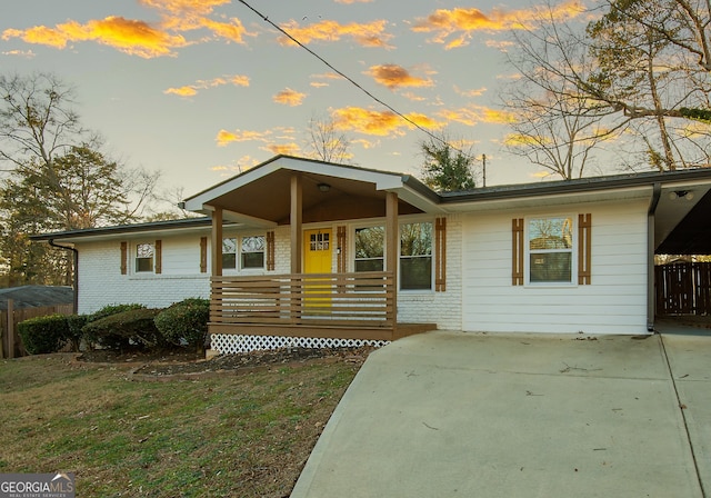 view of front of home featuring a yard and a porch