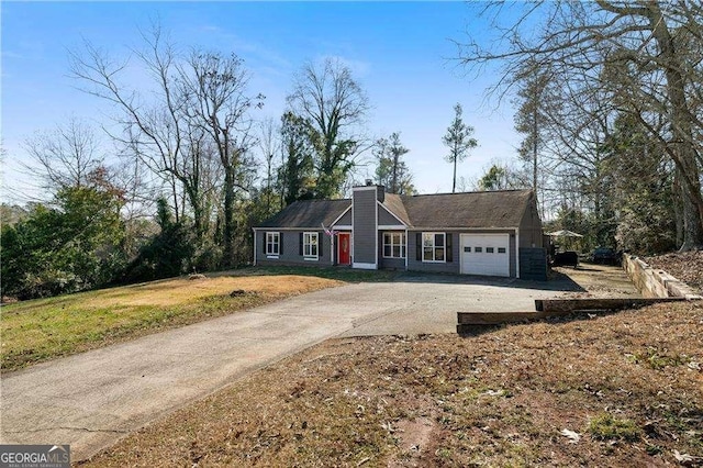 ranch-style house featuring a garage