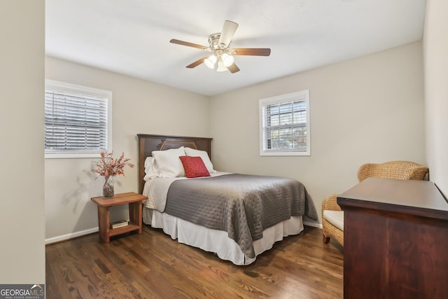 bedroom with ceiling fan and dark hardwood / wood-style floors