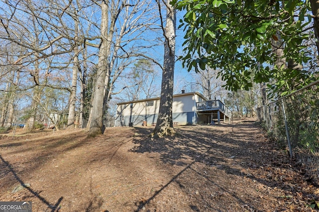 view of yard featuring a wooden deck