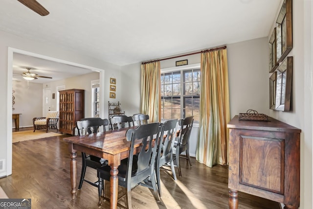 dining room featuring ceiling fan and dark hardwood / wood-style floors