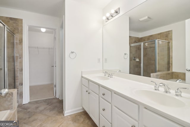 bathroom featuring vanity and a shower with shower door