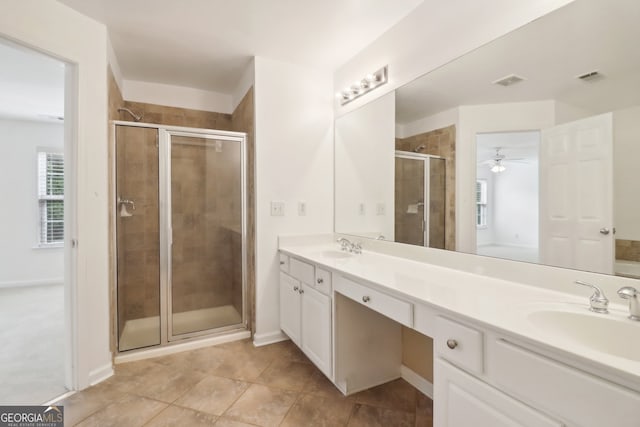 bathroom featuring ceiling fan, tile patterned flooring, vanity, and a shower with shower door