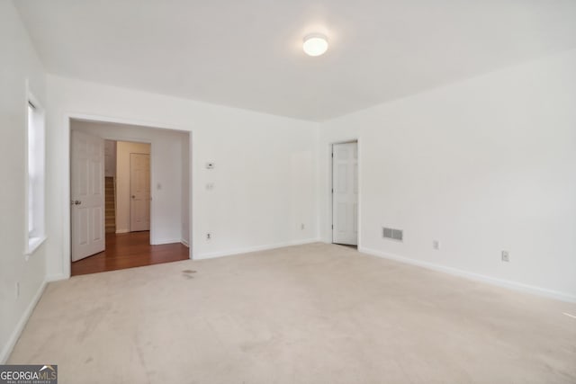 unfurnished room with carpet flooring