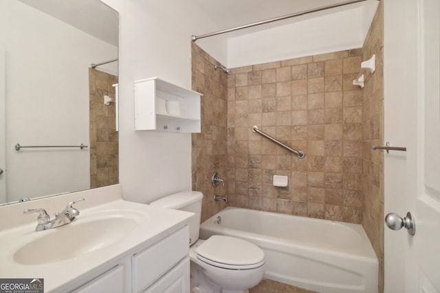 full bathroom featuring vanity, toilet, and tiled shower / bath