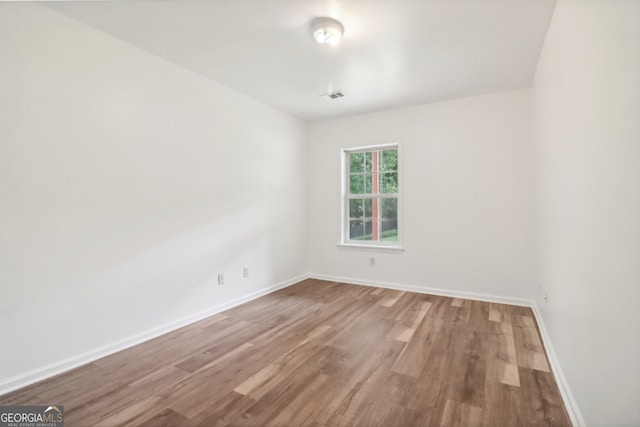 empty room featuring hardwood / wood-style floors