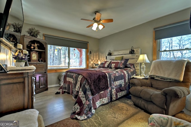 bedroom featuring ceiling fan and light hardwood / wood-style floors