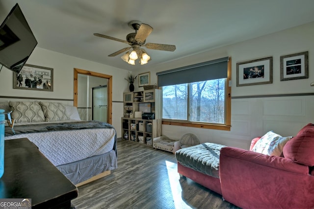 bedroom featuring dark hardwood / wood-style flooring and ceiling fan