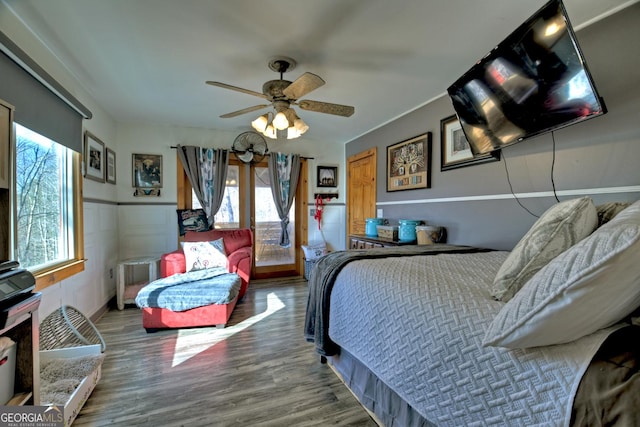 bedroom featuring wood-type flooring and ceiling fan