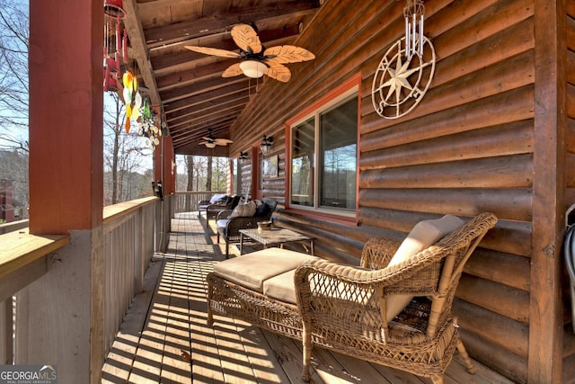 wooden terrace featuring ceiling fan