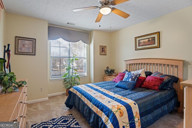 3700 Mays Xing SW, Atlanta, GA 30331 - bedroom with light colored carpet, a textured ceiling, a ceiling fan, and baseboards