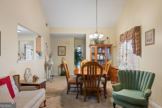 3700 Mays Xing SW, Atlanta, GA 30331 - dining room featuring a chandelier, carpet flooring, baseboards, and high vaulted ceiling