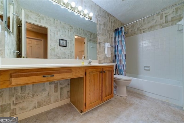 full bathroom with shower / bath combo with shower curtain, vanity, a textured ceiling, and toilet