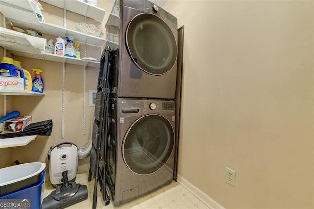 washroom featuring stacked washer and dryer