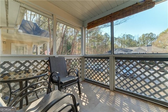 sunroom with wooden ceiling