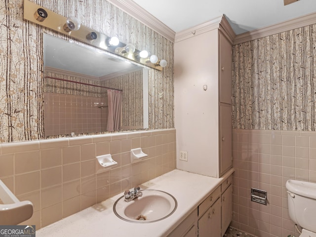 bathroom featuring tile walls, curtained shower, ornamental molding, and toilet