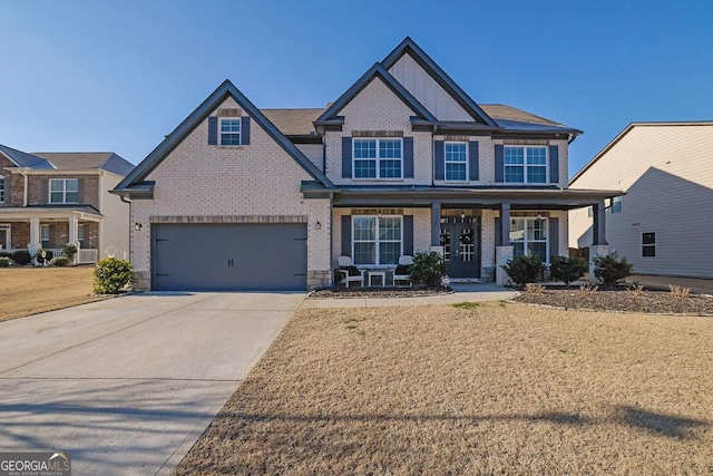 craftsman house with a garage and covered porch