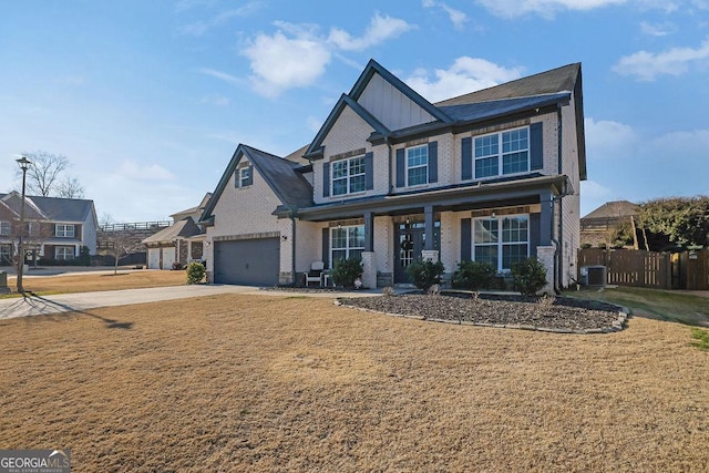 view of front of home with cooling unit and a garage