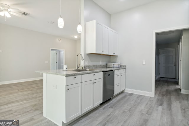 kitchen with sink, pendant lighting, dishwasher, white cabinets, and light hardwood / wood-style floors