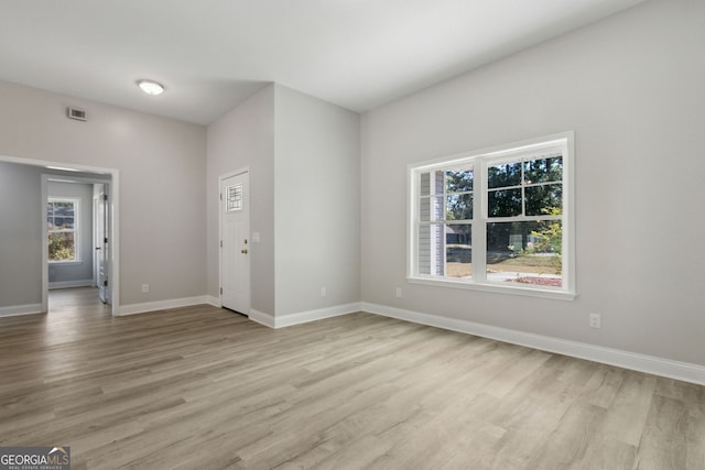 unfurnished room featuring light wood-type flooring