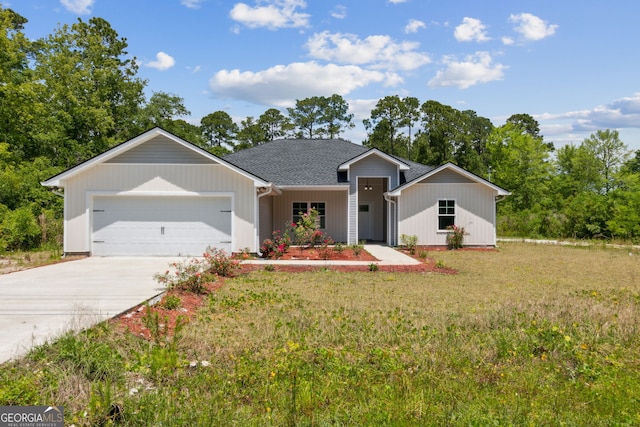 ranch-style house with a garage and a front lawn