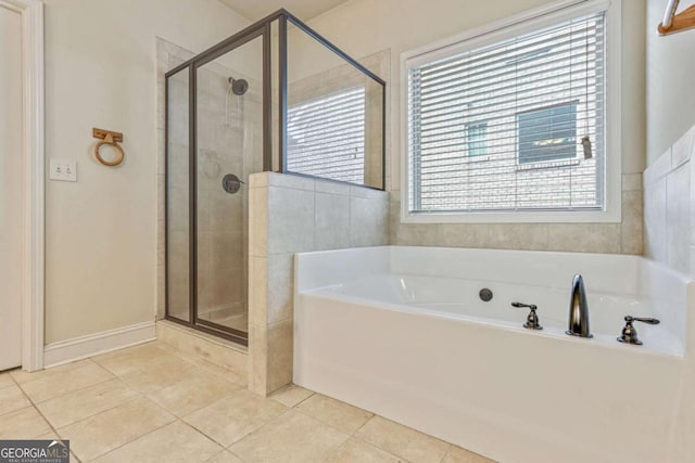 bathroom featuring tile patterned floors and plus walk in shower