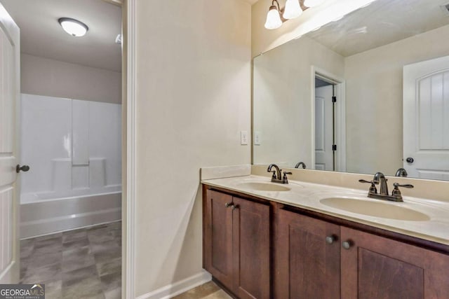 bathroom featuring shower / bathing tub combination and vanity