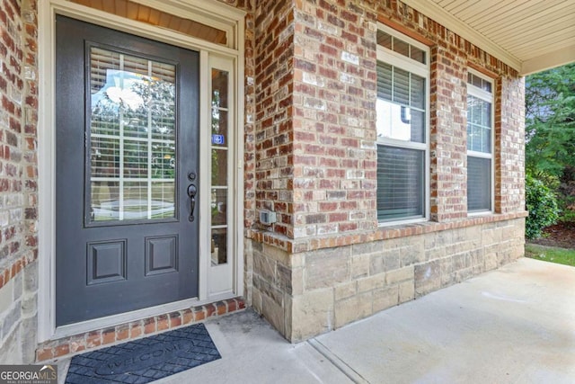 property entrance featuring a porch