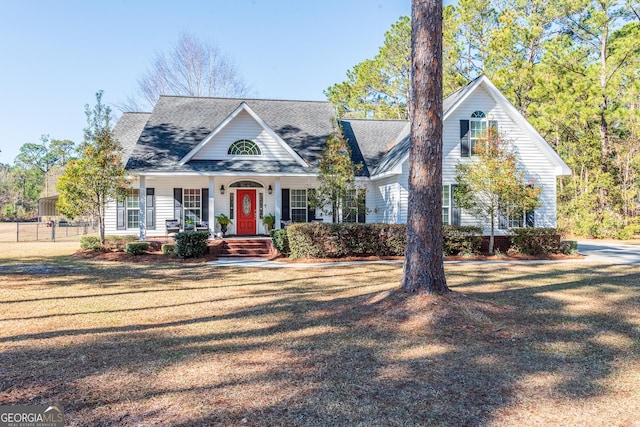 view of front of property with covered porch and a front yard