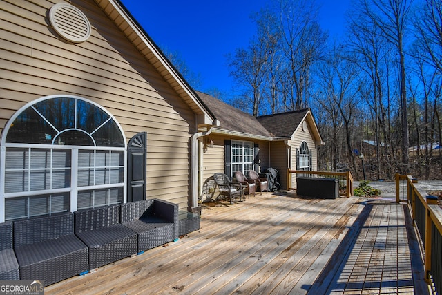 wooden deck with an outdoor hangout area