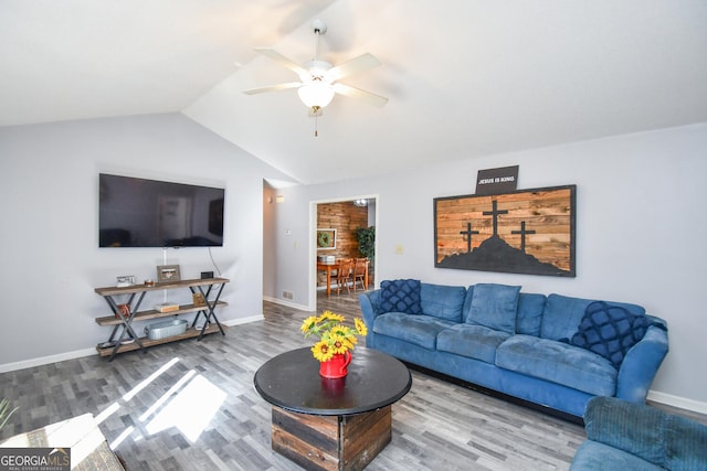 390 Apple Rdg Unit 2, Dawsonville, GA 30534 - living area with wood finished floors, vaulted ceiling, a ceiling fan, and baseboards