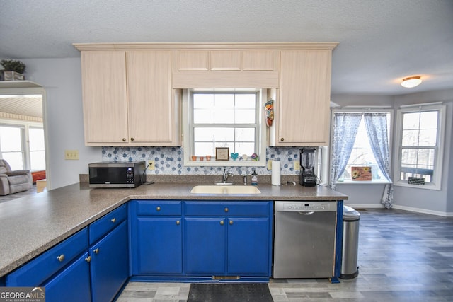 390 Apple Rdg Unit 2, Dawsonville, GA 30534 - kitchen with a sink, stainless steel appliances, blue cabinets, light wood-style flooring, and healthy amount of natural light