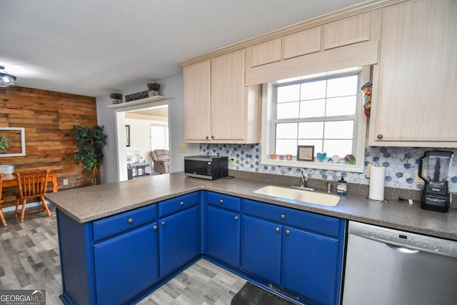 390 Apple Rdg Unit 2, Dawsonville, GA 30534 - kitchen with stainless steel dishwasher, a sink, a peninsula, blue cabinets, and light wood-style flooring