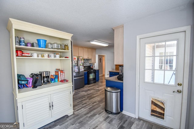 390 Apple Rdg Unit 2, Dawsonville, GA 30534 - kitchen with freestanding refrigerator, gas stove, dark wood-style floors, light brown cabinetry, and a textured ceiling