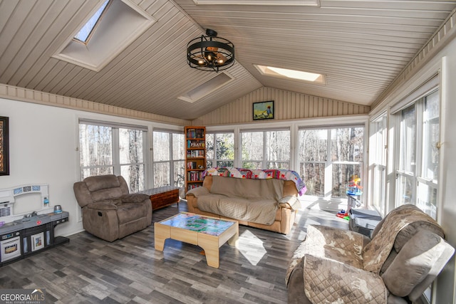 sunroom with lofted ceiling with skylight and a healthy amount of sunlight