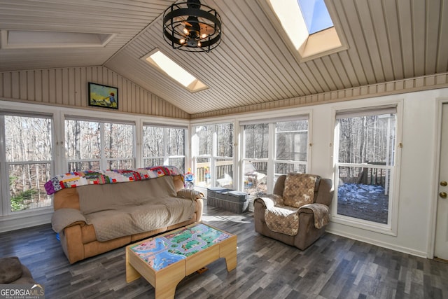 sunroom featuring lofted ceiling with skylight