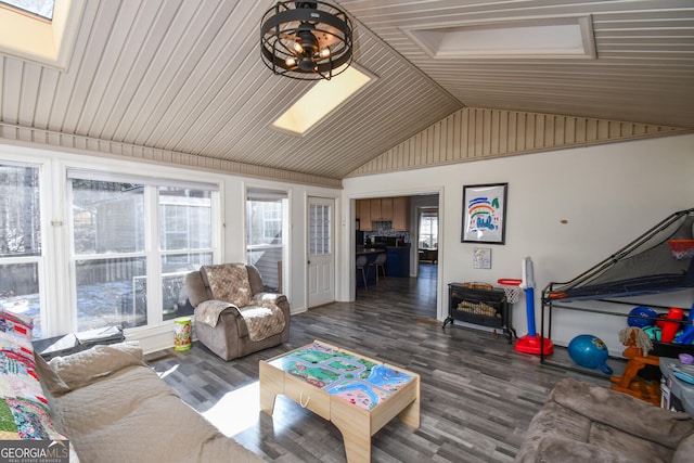 living room featuring dark hardwood / wood-style flooring and a skylight