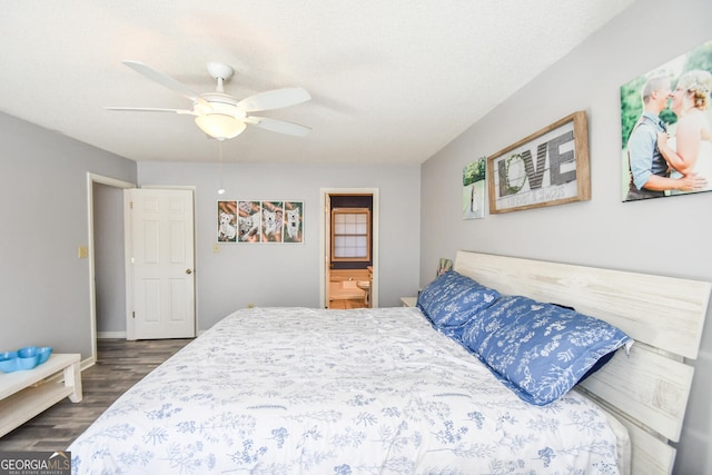 bedroom featuring ensuite bathroom, a textured ceiling, ceiling fan, and dark hardwood / wood-style flooring