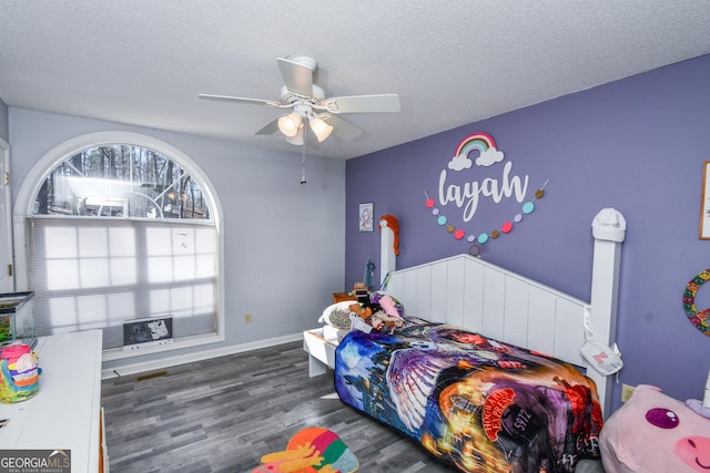 390 Apple Rdg Unit 2, Dawsonville, GA 30534 - bedroom featuring a textured ceiling, wood finished floors, a ceiling fan, and baseboards