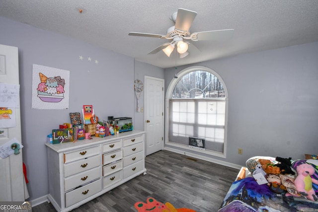 390 Apple Rdg Unit 2, Dawsonville, GA 30534 - bedroom featuring dark wood-style floors, a textured ceiling, baseboards, and a ceiling fan