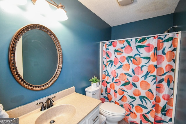 bathroom featuring toilet, vanity, a textured ceiling, and a shower with curtain