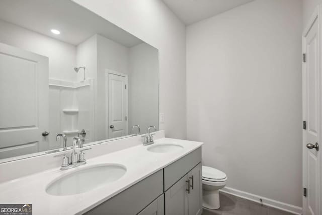 bathroom with walk in shower, tile patterned flooring, vanity, and toilet