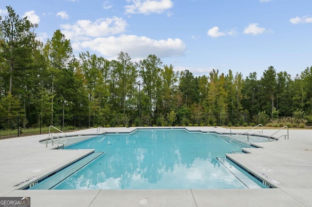 view of swimming pool featuring a patio