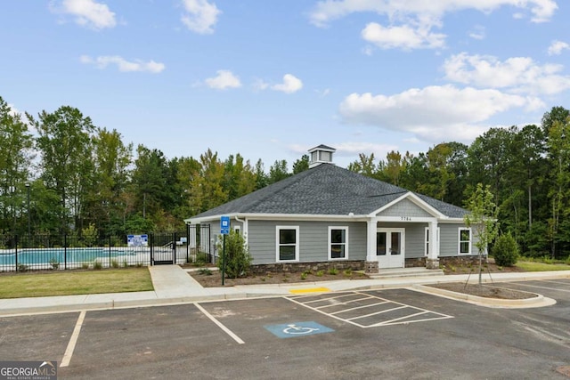 view of building exterior featuring a community pool