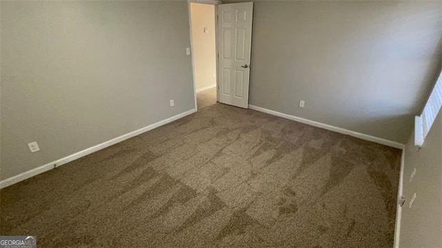 unfurnished room with carpet floors